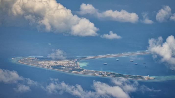 1436865761 SPRATLY ISLANDS, AT SEA - OCTOBER 25: An airfield, buildings, and structures are seen on the artificial island built by China in Subi Reef on October 25, 2022 in Spratly Islands, South China Sea. China has progressively asserted its claim of ownership over disputed islands in the South China Sea by artificially increasing the size of islands, creating new islands and building ports, military outposts and airstrips. The South China sea is an important trade route and is of significant interest as geopolitical tensions remain high in the region. (Photo by Ezra Acayan/Getty Images)