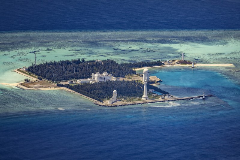 1436865595 SPRATLY ISLANDS, AT SEA - OCTOBER 25: Buildings and structures are seen on the artificial island built by China in Gaven Reefs on October 25, 2022 in Spratly Islands, South China Sea. China has progressively asserted its claim of ownership over disputed islands in the South China Sea by artificially increasing the size of islands, creating new islands and building ports, military outposts and airstrips. The South China sea is an important trade route and is of significant interest as geopolitical tensions remain high in the region. (Photo by Ezra Acayan/Getty Images)