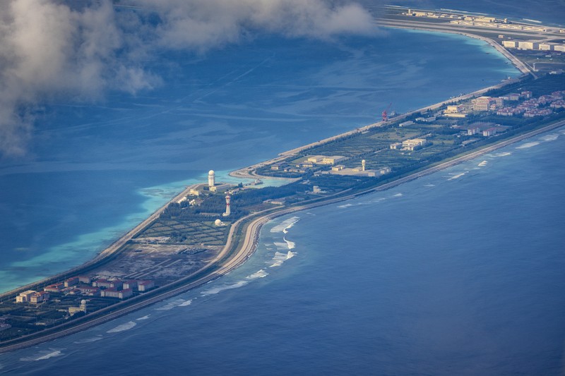 SPRATLY ISLANDS, AT SEA - OCTOBER 25: Buildings and structures are seen on the artificial island built by China in Gaven Reefs on October 25, 2022 in Spratly Islands, South China Sea. China has progressively asserted its claim of ownership over disputed islands in the South China Sea by artificially increasing the size of islands, creating new islands and building ports, military outposts and airstrips. The South China sea is an important trade route and is of significant interest as geopolitical tensions remain high in the region. (Photo by Ezra Acayan/Getty Images)