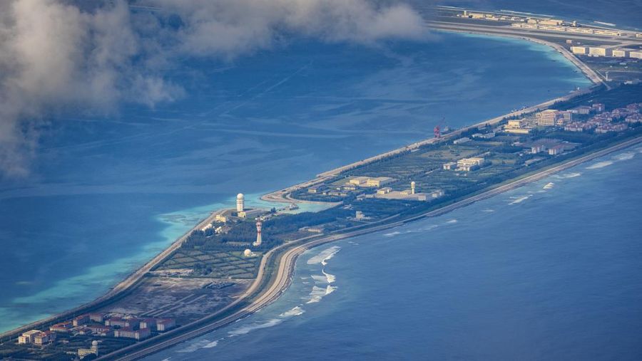 SPRATLY ISLANDS, AT SEA - OCTOBER 25: Buildings and structures are seen on the artificial island built by China in Gaven Reefs on October 25, 2022 in Spratly Islands, South China Sea. China has progressively asserted its claim of ownership over disputed islands in the South China Sea by artificially increasing the size of islands, creating new islands and building ports, military outposts and airstrips. The South China sea is an important trade route and is of significant interest as geopolitical tensions remain high in the region. (Photo by Ezra Acayan/Getty Images)