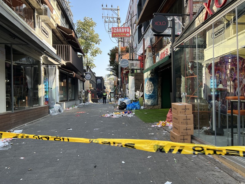 SEOUL, SOUTH KOREA - OCTOBER 30: A cordon line is set up near the scene of a deadly stampede on October 30, 2022 in Seoul, South Korea. At least 153 people were killed and 103 others injured in the Halloween stampede that occurred Saturday night at Itaewon, a district of the South Korean capital Seoul. (Photo by Liu Xu/China News Service via Getty Images) SEOUL, SOUTH KOREA - OCTOBER 30: A cordon line is set up near the scene of a deadly stampede on October 30, 2022 in Seoul, South Korea. At least 153 people were killed and 103 others injured in the Halloween stampede that occurred Saturday night at Itaewon, a district of the South Korean capital Seoul. (Photo by Liu Xu/China News Service via Getty Images)