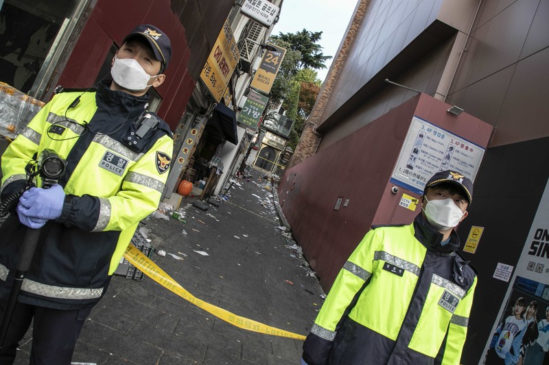 SEOUL, SOUTH KOREA - OCTOBER 30: A cordon line is set up near the scene of a deadly stampede on October 30, 2022 in Seoul, South Korea. At least 153 people were killed and 103 others injured in the Halloween stampede that occurred Saturday night at Itaewon, a district of the South Korean capital Seoul. (Photo by Liu Xu/China News Service via Getty Images) SEOUL, SOUTH KOREA - OCTOBER 30: A cordon line is set up near the scene of a deadly stampede on October 30, 2022 in Seoul, South Korea. At least 153 people were killed and 103 others injured in the Halloween stampede that occurred Saturday night at Itaewon, a district of the South Korean capital Seoul. (Photo by Liu Xu/China News Service via Getty Images)