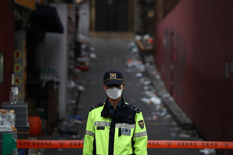 SEOUL, SOUTH KOREA - OCTOBER 30: A cordon line is set up near the scene of a deadly stampede on October 30, 2022 in Seoul, South Korea. At least 153 people were killed and 103 others injured in the Halloween stampede that occurred Saturday night at Itaewon, a district of the South Korean capital Seoul. (Photo by Liu Xu/China News Service via Getty Images) SEOUL, SOUTH KOREA - OCTOBER 30: A cordon line is set up near the scene of a deadly stampede on October 30, 2022 in Seoul, South Korea. At least 153 people were killed and 103 others injured in the Halloween stampede that occurred Saturday night at Itaewon, a district of the South Korean capital Seoul. (Photo by Liu Xu/China News Service via Getty Images)