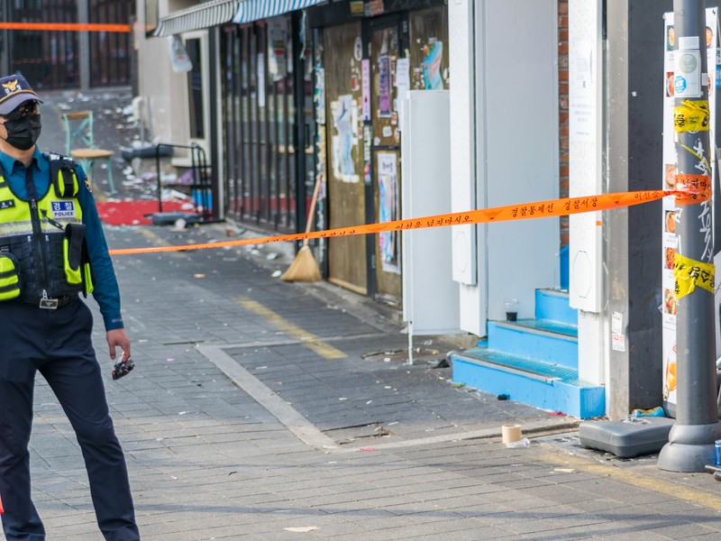 SEOUL, SOUTH KOREA - OCTOBER 30: A cordon line is set up near the scene of a deadly stampede on October 30, 2022 in Seoul, South Korea. At least 153 people were killed and 103 others injured in the Halloween stampede that occurred Saturday night at Itaewon, a district of the South Korean capital Seoul. (Photo by Liu Xu/China News Service via Getty Images) SEOUL, SOUTH KOREA - OCTOBER 30: A cordon line is set up near the scene of a deadly stampede on October 30, 2022 in Seoul, South Korea. At least 153 people were killed and 103 others injured in the Halloween stampede that occurred Saturday night at Itaewon, a district of the South Korean capital Seoul. (Photo by Liu Xu/China News Service via Getty Images)
