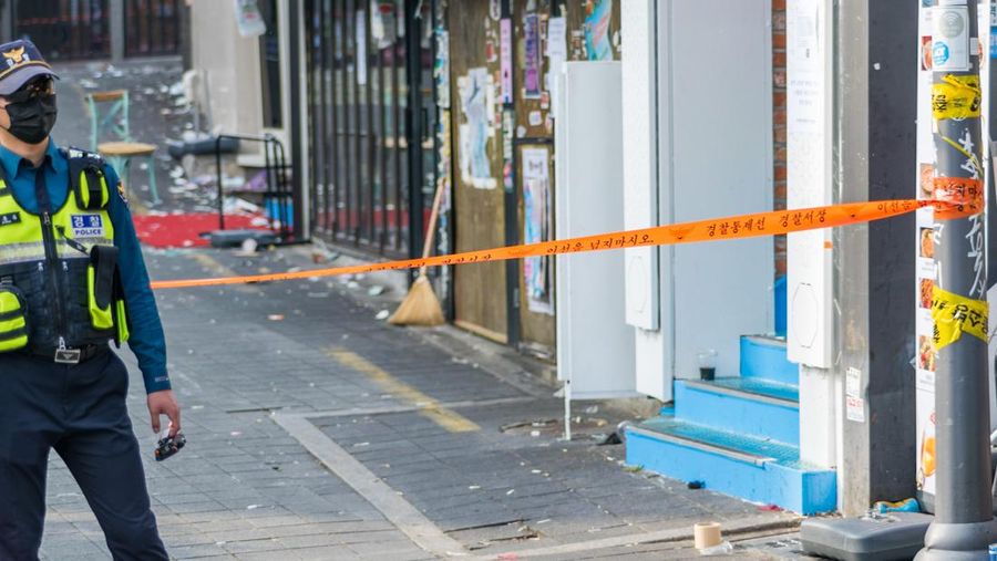 SEOUL, SOUTH KOREA - OCTOBER 30: A cordon line is set up near the scene of a deadly stampede on October 30, 2022 in Seoul, South Korea. At least 153 people were killed and 103 others injured in the Halloween stampede that occurred Saturday night at Itaewon, a district of the South Korean capital Seoul. (Photo by Liu Xu/China News Service via Getty Images)