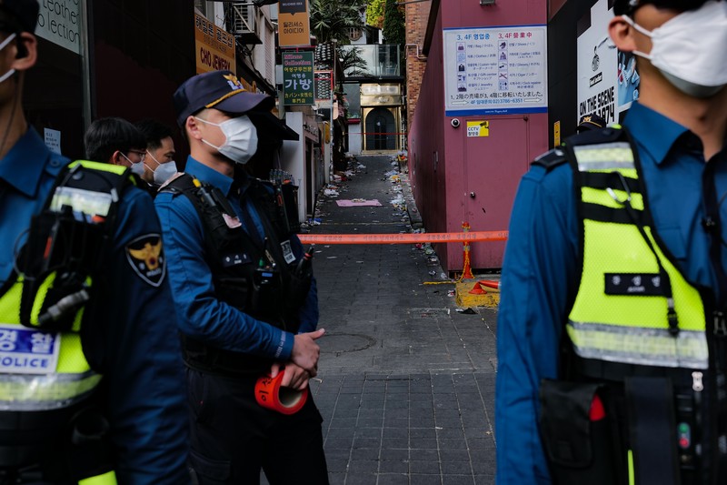 SEOUL, SOUTH KOREA - OCTOBER 30: A cordon line is set up near the scene of a deadly stampede on October 30, 2022 in Seoul, South Korea. At least 153 people were killed and 103 others injured in the Halloween stampede that occurred Saturday night at Itaewon, a district of the South Korean capital Seoul. (Photo by Liu Xu/China News Service via Getty Images)