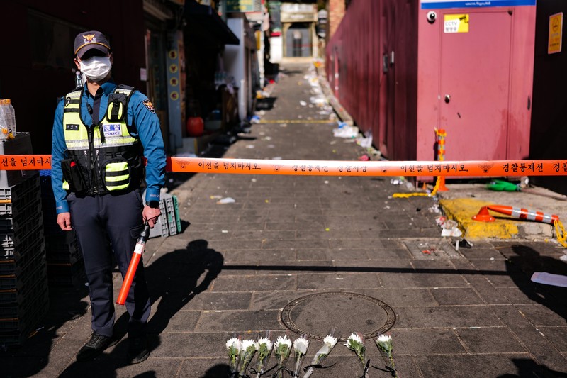 SEOUL, SOUTH KOREA - OCTOBER 30: A cordon line is set up near the scene of a deadly stampede on October 30, 2022 in Seoul, South Korea. At least 153 people were killed and 103 others injured in the Halloween stampede that occurred Saturday night at Itaewon, a district of the South Korean capital Seoul. (Photo by Liu Xu/China News Service via Getty Images) SEOUL, SOUTH KOREA - OCTOBER 30: A cordon line is set up near the scene of a deadly stampede on October 30, 2022 in Seoul, South Korea. At least 153 people were killed and 103 others injured in the Halloween stampede that occurred Saturday night at Itaewon, a district of the South Korean capital Seoul. (Photo by Liu Xu/China News Service via Getty Images)