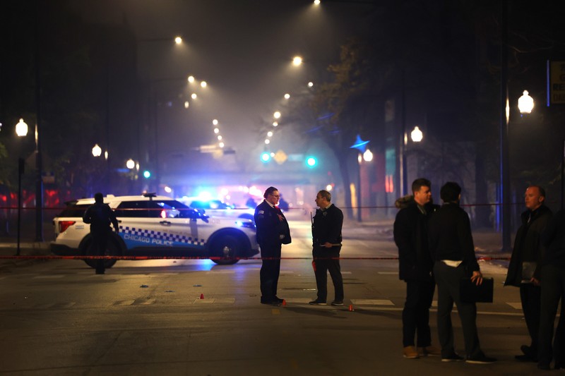 Halloween-Shootings Chicago Chicago police and emergency medical responders work at the scene of a mass shooting near Polk Street and California Avenue on the city's West Side on Monday, Oct. 31, 2022. Chicago Police say several people were injured in a drive-by shooting Halloween night, including three children (E. Jason Wambsgans /Chicago Tribune via AP)