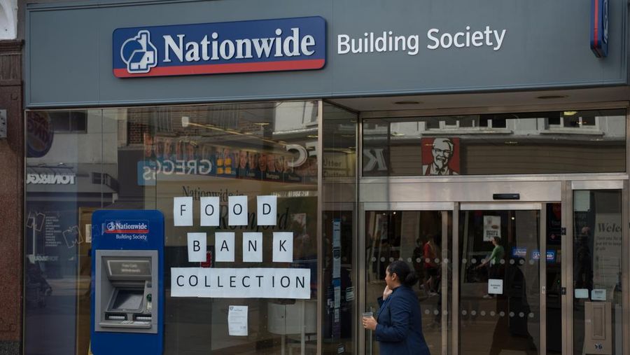 ROMFORD, ENGLAND - OCTOBER 27: A food bank collection is advertised in the window of a Halifax building society branch on South Street  on October 27, 2022 in Romford, England. (File. John Keeble/Getty Images)