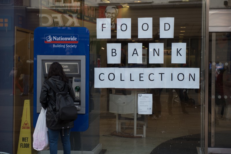ROMFORD, ENGLAND - OCTOBER 27: A food bank collection is advertised in the window of a Halifax building society branch on South Street  on October 27, 2022 in Romford, England. (File. John Keeble/Getty Images)
