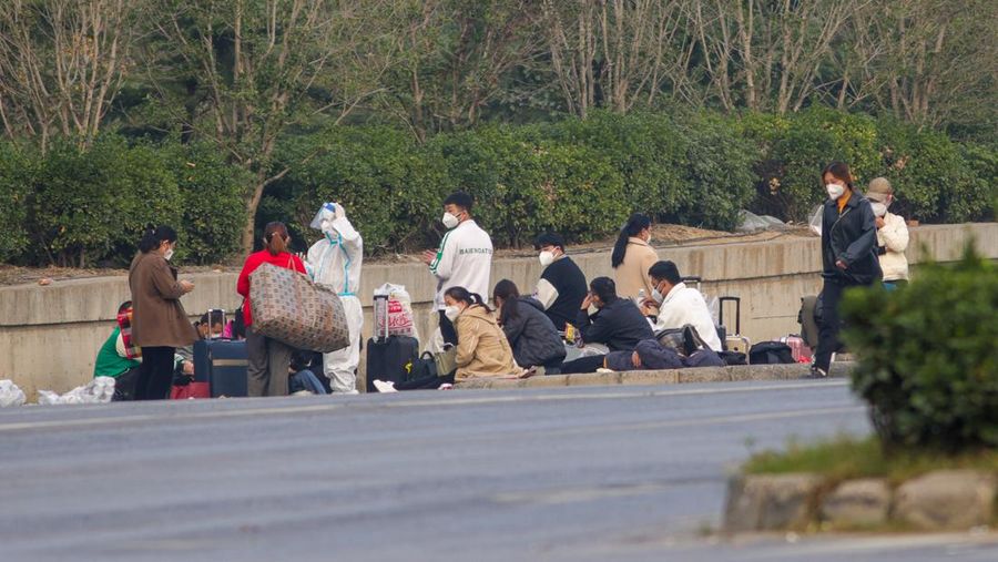ZHENGZHOU, CHINA - OCTOBER 30: Foxconn employees wait to take shuttle buses to head home on October 30, 2022 in Zhengzhou, Henan Province of China. Shuttle buses have been arranged by local authorities to facilitate the return trips of Foxconn factory workers to their hometowns after COVID-19 infections were reported in the city Zhengzhou. (VCG/VCG via Getty Images)