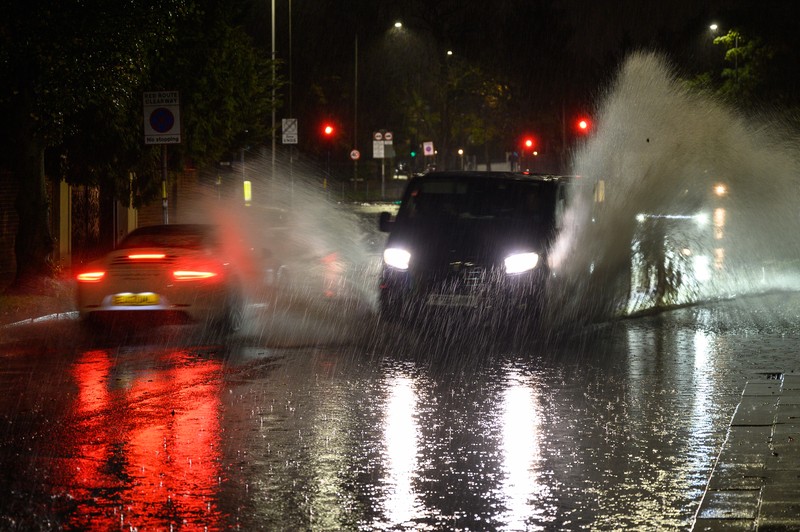 London, England. Torrential rain and flash flooding LONDON, ENGLAND - NOVEMBER 02: Vehicles negotiate a flooded section of the A1 road on November 02, 2022 in London, England. Torrential rain and flash flooding hit the region late on Wednesday evening, causing traffic jams as cars became stuck in the standing water. (Leon Neal/Getty Images)