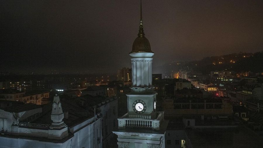 A tower of the National Bank of Ukraine is seen during a blackout in Kyiv, Ukraine, Sunday, Nov. 6, 2022. (AP Photo/Andrew Kravchenko)