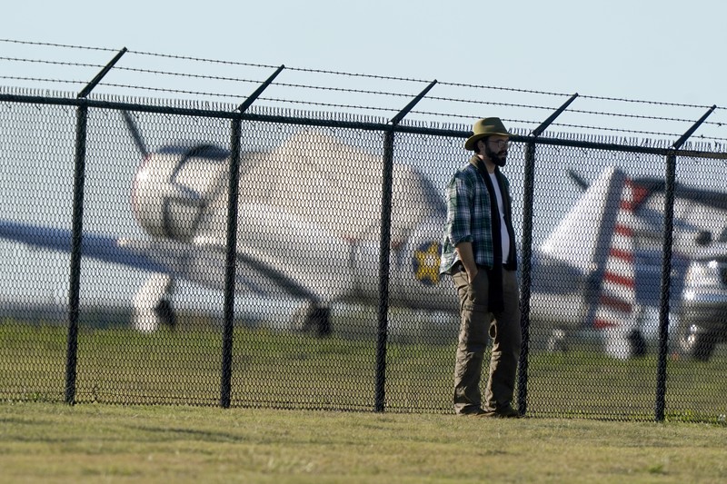 In this photo provided by Nathaniel Ross Photography, a historic military plane crashes after colliding with another plane during an airshow at Dallas Executive Airport in Dallas on Saturday, Nov. 12, 2022. (Nathaniel Ross Photography via AP)