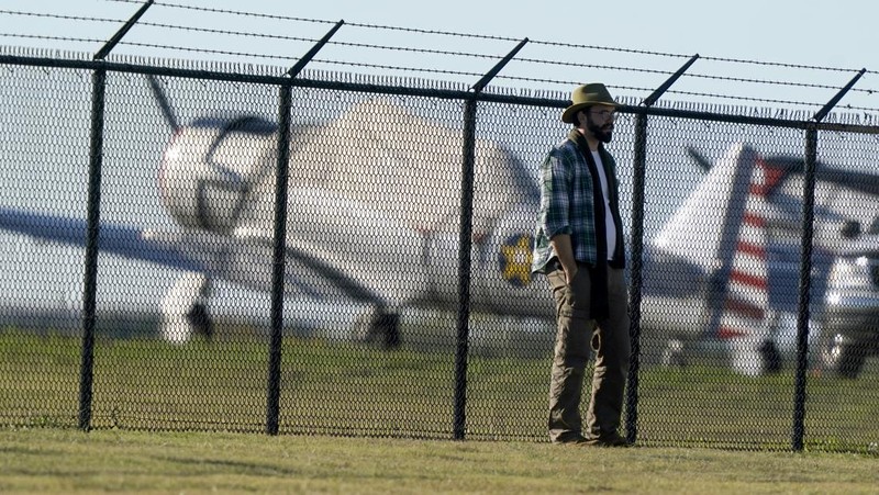 In this photo provided by Nathaniel Ross Photography, a historic military plane crashes after colliding with another plane during an airshow at Dallas Executive Airport in Dallas on Saturday, Nov. 12, 2022. (Nathaniel Ross Photography via AP)
