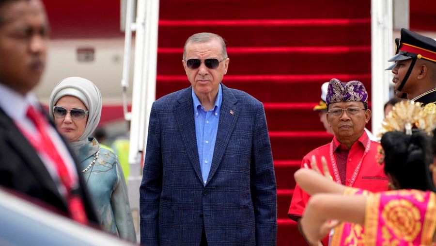 Turkish President Recep Tayyip Erdogan with his wife Emine Erdogan walks out of the presidential plane upon arrival at Gusti Ngurah Rai Airport, Bali, Indonesia November 14, 2022. M Risyal Hidayat/G20 Media Center/Handout via REUTERS THIS IMAGE HAS BEEN SUPPLIED BY A THIRD PARTY. MANDATORY CREDIT.