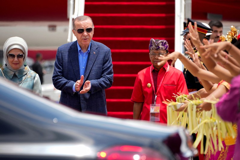 Turkish President Recep Tayyip Erdogan with his wife Emine Erdogan walks out of the presidential plane upon arrival at Gusti Ngurah Rai Airport, Bali, Indonesia November 14, 2022. M Risyal Hidayat/G20 Media Center/Handout via REUTERS THIS IMAGE HAS BEEN SUPPLIED BY A THIRD PARTY. MANDATORY CREDIT.