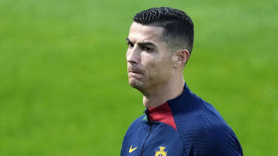 Cristiano Ronaldo walks on the pitch during a Portugal soccer team training in Oeiras, outside Lisbon, Monday, Nov. 14, 2022. Portugal will play Nigeria Thursday in a friendly match in Lisbon before departing to Qatar on Friday for the World Cup. (AP Photo/Armando Franca)