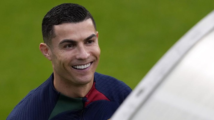 Cristiano Ronaldo smiles as he arrives for a Portugal soccer team training session in Oeiras, outside Lisbon, Monday, Nov. 14, 2022. Portugal will play Nigeria Thursday in a friendly match in Lisbon before departing to Qatar on Friday for the World Cup. (AP Photo/Armando Franca)