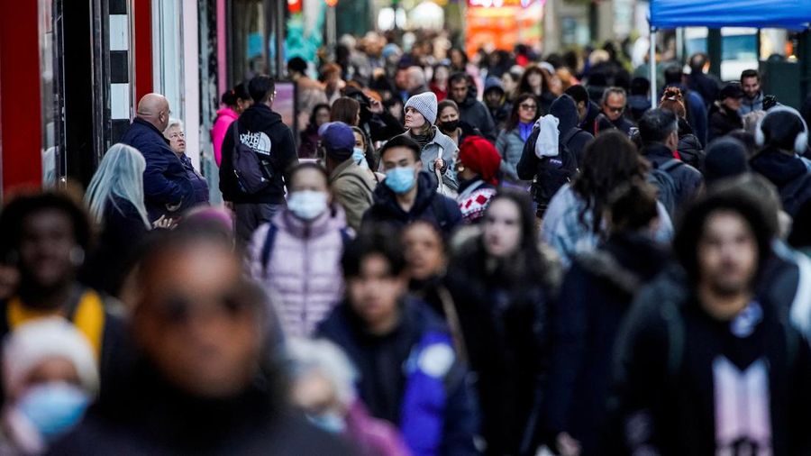 People walk on the New York City street of 34 in Manhattan as according to a United Nations report, the world's population is estimated to reach 8 billion by November 15 of this year, in New York, U.S., November 14, 2022. REUTERS/Eduardo Munoz