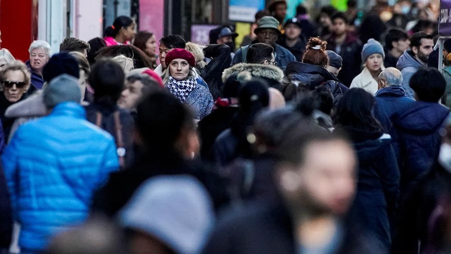 People walk on the New York City street of 34 in Manhattan as according to a United Nations report, the world's population is estimated to reach 8 billion by November 15 of this year, in New York, U.S., November 14, 2022. REUTERS/Eduardo Munoz