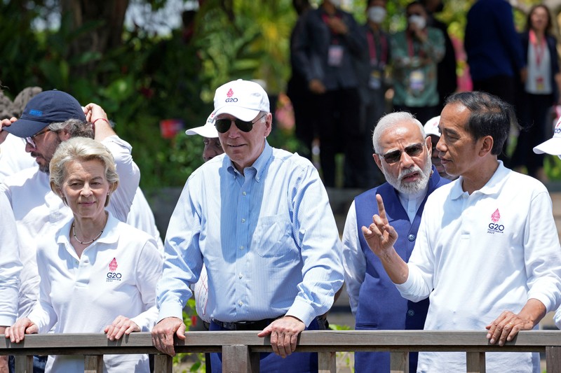 Biden G20 Leaders raise their garden hoes for a group photo during a tree planting event at the Taman Hutan Raya Ngurah Rai Mangrove Forest, on the sidelines of the G20 summit meeting, Wednesday, Nov. 16, 2022, in Denpasar, Bali, Indonesia. (AP Photo/Alex Brandon, Pool)