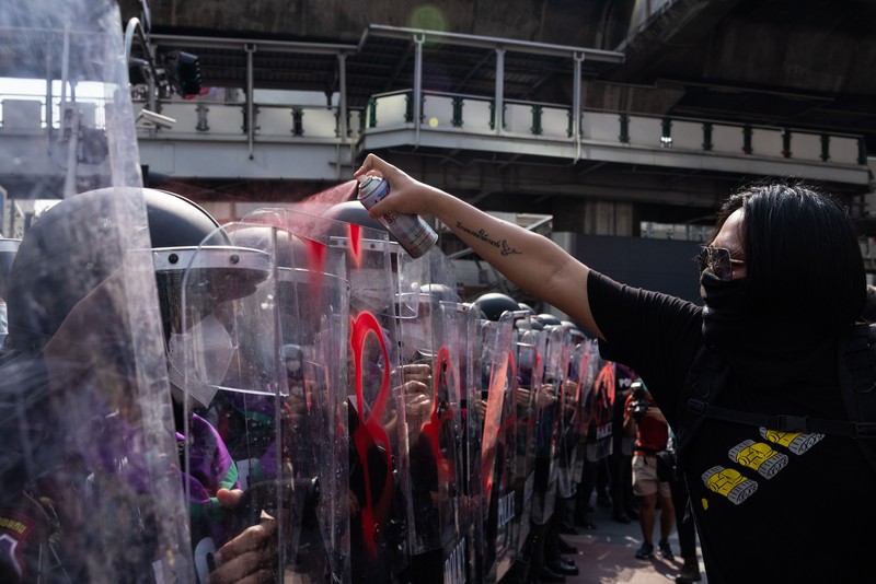 BANGKOK, THAILAND - NOVEMBER 17: A protester carries a Winnie the Pooh teddy bear representing Xi Jinping next to riot police during a demonstration nearby the site of the Asia-Pacific Economic Cooperation (APEC) summit on November 17, 2022 in Bangkok, Thailand. Thailand is hosting the APEC meetings this year, which will culminate in the leaders' meetings which will run from Nov. 17 to 19. (Photo by Louise Delmotte/Getty Images)