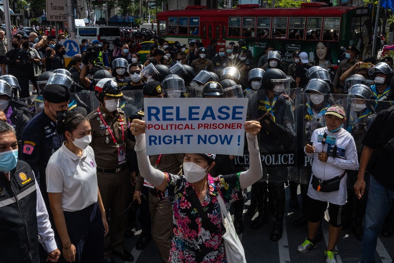 BANGKOK, THAILAND - NOVEMBER 17: A protester carries a Winnie the Pooh teddy bear representing Xi Jinping next to riot police during a demonstration nearby the site of the Asia-Pacific Economic Cooperation (APEC) summit on November 17, 2022 in Bangkok, Thailand. Thailand is hosting the APEC meetings this year, which will culminate in the leaders' meetings which will run from Nov. 17 to 19. (Photo by Louise Delmotte/Getty Images)