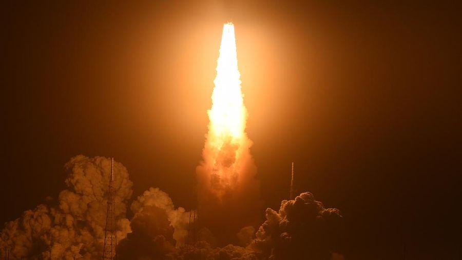 People at Veterans Memorial park watch as the Artemis I unmanned lunar rocket lifts off from launch pad 39B at NASA's Kennedy Space Center, in Titusville, Florida, on November 16, 2022. - NASA's Artemis 1 mission is a 25-and-a-half day voyage beyond the far side of the Moon and back. The meticulously choreographed uncrewed flight should yield spectacular images as well as valuable scientific data. (Photo by Marco BELLO / AFP) (Photo by MARCO BELLO/AFP via Getty Images)
