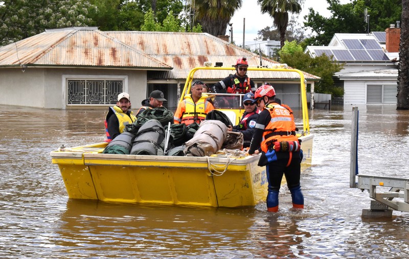Australia Floods One of the many vehicles swept away during a flash flood, sits embedded in a tree in the town of Eugowra, Central West New South Wales, Tuesday, Nov. 15, 2022. A rare third consecutive La Niña weather pattern, which is associated with above-average rainfall in eastern Australia, has created a flooding emergency across large swathes of New South Wales that has lasted for two months.(Murray McCloskey/AAP Image via AP)