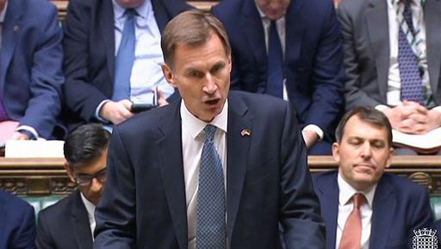 A video grab from footage broadcast by the UK Parliament's Parliamentary Recording Unit (PRU) shows Britain's Chancellor of the Exchequer Jeremy Hunt making an autumn budget statement in the House of Commons in London on November 17, 2022. - Britain is set to unveil hefty tax rises and spending cuts at the risk of worsening a cost-of-living crisis for millions in the recession-bound economy. (Photo by Handout / PRU / AFP) / RESTRICTED TO EDITORIAL USE - NO USE FOR ENTERTAINMENT, SATIRICAL, ADVERTISING PURPOSES - MANDATORY CREDIT 