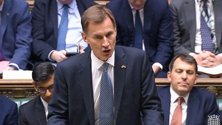BRITAIN-POLITICS-BUDGET A video grab from footage broadcast by the UK Parliament's Parliamentary Recording Unit (PRU) shows Britain's Chancellor of the Exchequer Jeremy Hunt making an autumn budget statement in the House of Commons in London on November 17, 2022. - Britain is set to unveil hefty tax rises and spending cuts at the risk of worsening a cost-of-living crisis for millions in the recession-bound economy. (Photo by Handout / PRU / AFP) / RESTRICTED TO EDITORIAL USE - NO USE FOR ENTERTAINMENT, SATIRICAL, ADVERTISING PURPOSES - MANDATORY CREDIT
