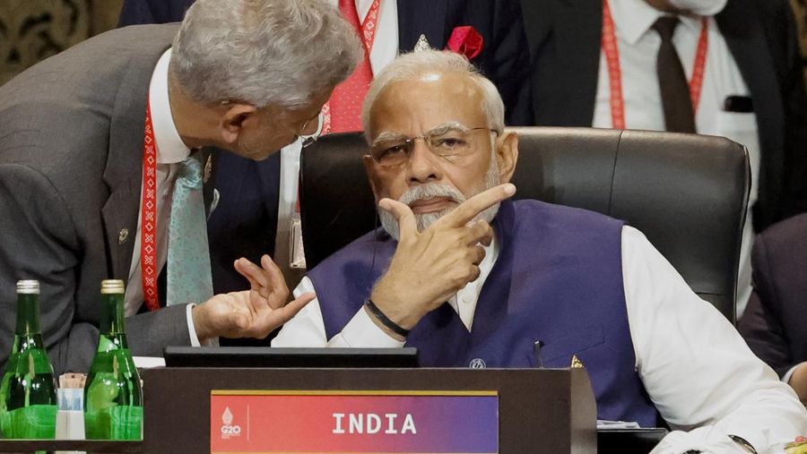 India's Prime Minister Narendra Modi, right, speaks with Foreign Minister Subrahmanyam Jaishankar at the G20 Leaders' Summit, in Nusa Dua, Bali, Indonesia, Wednesday Nov. 16, 2022. (Willy Kurniawan/Pool Photo via AP)