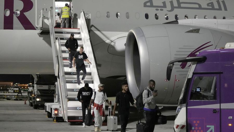 DOHA, QATAR - NOVEMBER 17: Players of Argentina disembark the airplane at Hamad International Airport ahead of FIFA World Cup Qatar 2022 at  on November 17, 2022 in Doha, Qatar. (Photo by Justin Setterfield/Getty Images)