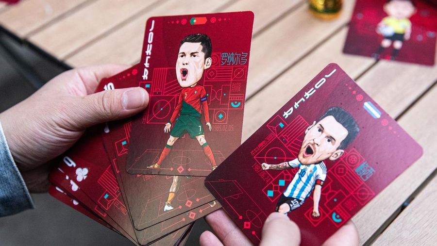 WUHAN, CHINA - NOVEMBER 16:（CHINA OUT）Caricatures of Cristiano Ronaldo and Lionel Messi adorn poker playing card from a set created by the cartoonist Tao Gang, 40, for the 2022 Qatar World Cup on November 16, 2022 in Wuhan, Hubei province, China. Tao spent three months painting the portraits. The opening ceremony of the 22nd World Cup will be held in Doha, the capital of Qatar, on November 20.  (Photo by Getty Images)