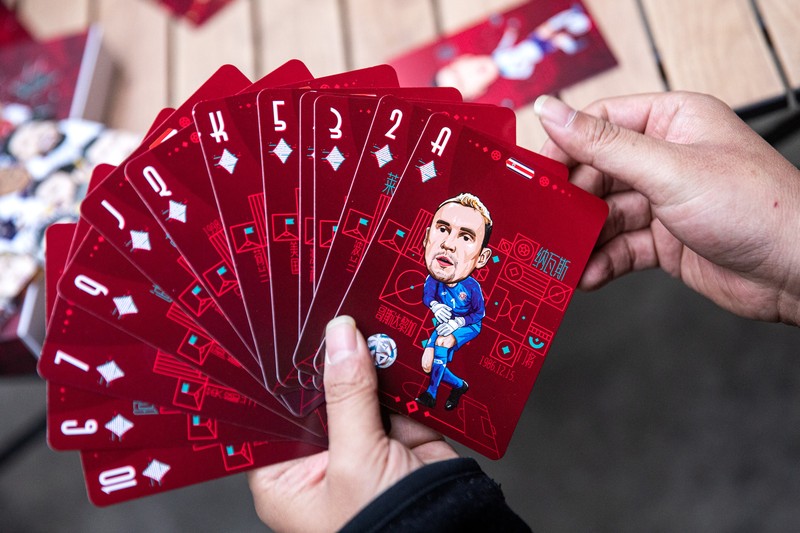 WUHAN, CHINA - NOVEMBER 16:（CHINA OUT）A set of playing cards is shown bearing caricatures of World Cup star players, created by the cartoonist Tao Gang, 40, for the 2022 Qatar World Cup on November 16, 2022 in Wuhan, Hubei province, China. Tao spent three months painting the portraits. The opening ceremony of the 22nd World Cup will be held in Doha, the capital of Qatar, on November 20.  (Photo by Getty Images)