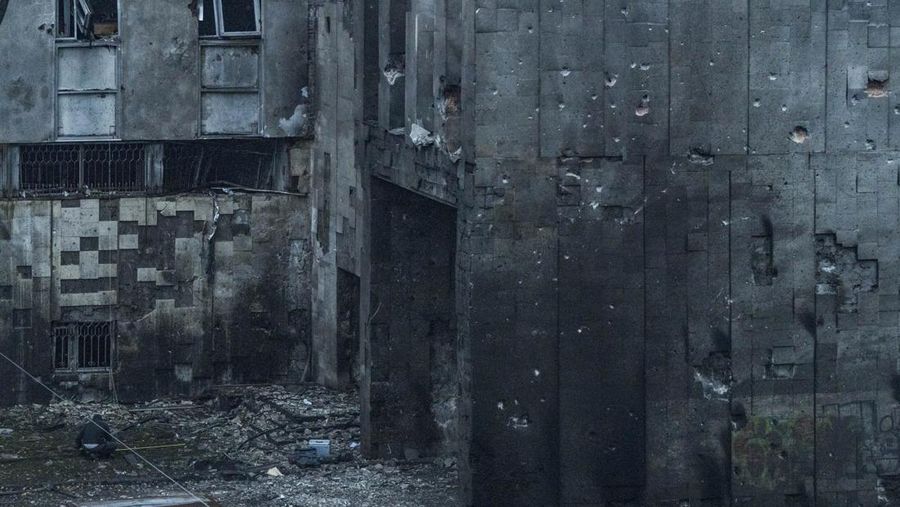 A man takes measures of his destroyed window by the shock wave of the explosion of a russian missile over Dnipro city, Ukraine. (Photo by Celestino Arce/NurPhoto via Getty Images)