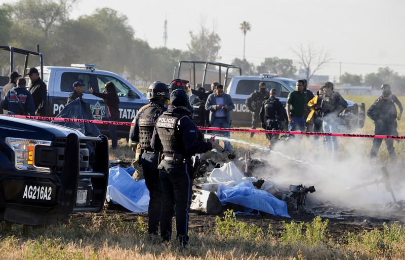 Members of security forces check the site where the head of security of the central Mexican state of Aguascalientes has died in a helicopter crash, in Aguascalientes, Mexico November 17, 2022. REUTERS/Liberto Urena NO RESALES. NO ARCHIVES
