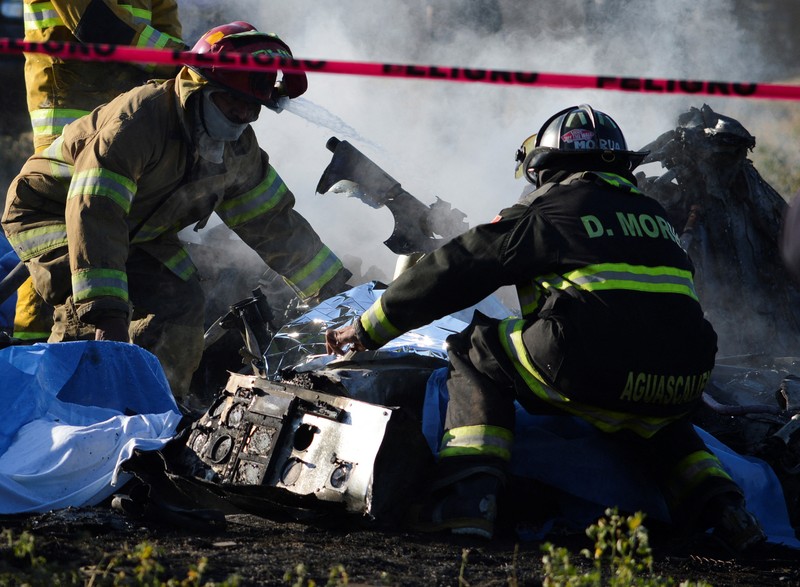 Members of security forces check the site where the head of security of the central Mexican state of Aguascalientes has died in a helicopter crash, in Aguascalientes, Mexico November 17, 2022. REUTERS/Liberto Urena NO RESALES. NO ARCHIVES