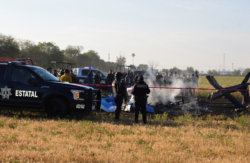 Members of security forces check the site where the head of security of the central Mexican state of Aguascalientes has died in a helicopter crash, in Aguascalientes, Mexico November 17, 2022. REUTERS/Liberto Urena NO RESALES. NO ARCHIVES