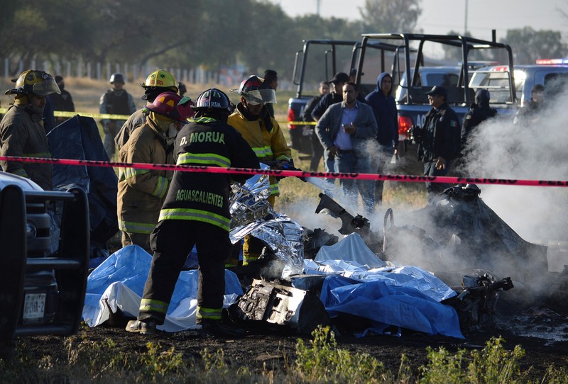 Members of security forces check the site where the head of security of the central Mexican state of Aguascalientes has died in a helicopter crash, in Aguascalientes, Mexico November 17, 2022. REUTERS/Liberto Urena NO RESALES. NO ARCHIVES