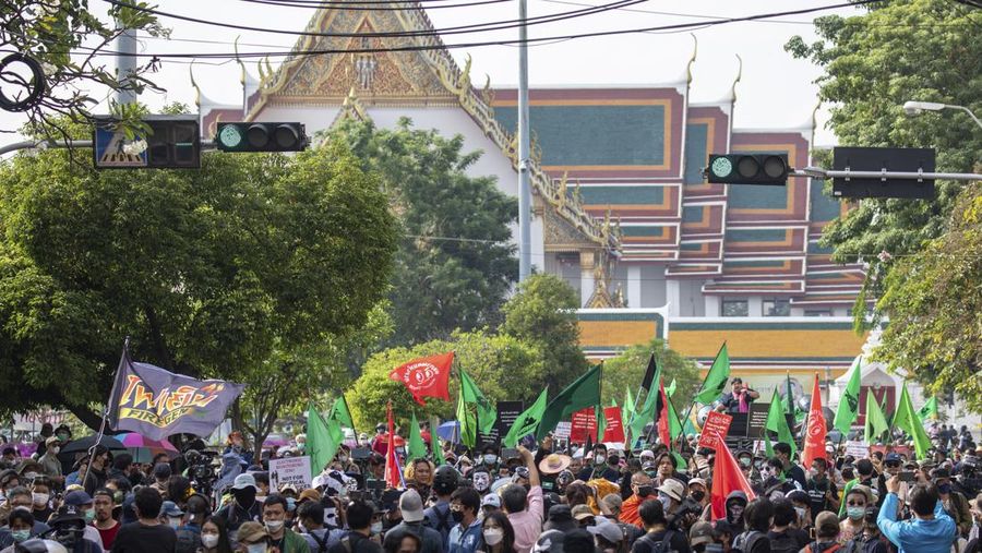 Protesters are blocked by police from marching to the Asia-Pacific Economic Cooperation APEC summit venue, Friday, Nov. 18, 2022, in Bangkok, Thailand. (AP Photo/Wason Wanichakorn)