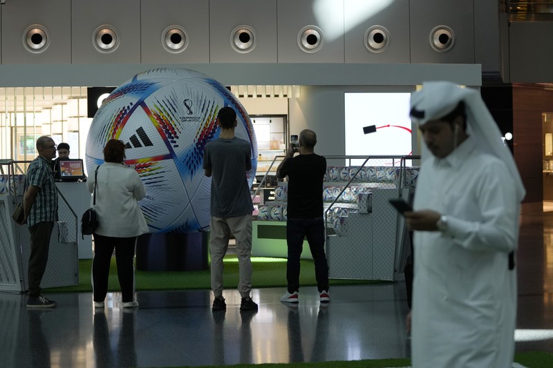 Passengers walk at Hamad International Airport in Doha, Qatar, Thursday, Nov. 10, 2022.   (AP Photo/Hassan Ammar)