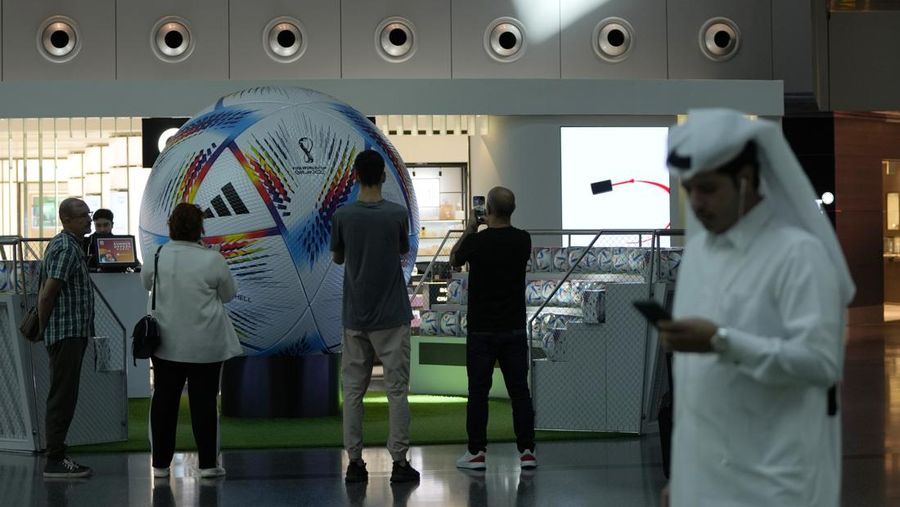 Passengers walk at Hamad International Airport in Doha, Qatar, Thursday, Nov. 10, 2022.   (AP Photo/Hassan Ammar)