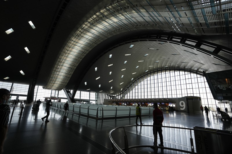 Passengers walk at Hamad International Airport in Doha, Qatar, Thursday, Nov. 10, 2022.   (AP Photo/Hassan Ammar)