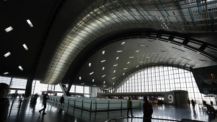 Passengers walk at Hamad International Airport in Doha, Qatar, Thursday, Nov. 10, 2022.   (AP Photo/Hassan Ammar)