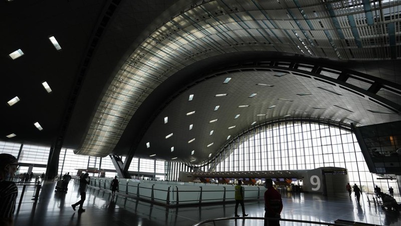 Passengers walk at Hamad International Airport in Doha, Qatar, Thursday, Nov. 10, 2022.   (AP Photo/Hassan Ammar)