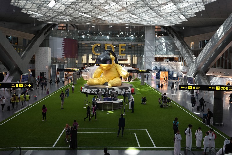 Qatar WCup Soccer Airport Passengers walk at Hamad International Airport in Doha, Qatar, Thursday, Nov. 10, 2022. (AP Photo/Hassan Ammar)