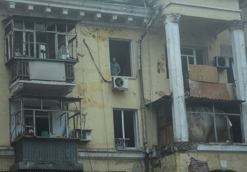 1244860556 A man takes measures of his destroyed window by the shock wave of the explosion of a russian missile over Dnipro city, Ukraine. (Photo by Celestino Arce/NurPhoto via Getty Images)
