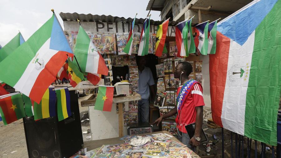 Equatorial Guinea African Cup Soccer A man sells flags of different countries participating at African Cup of Nations on the street in the neighborhood of Estadio De Malabo, Equatorial Guinea, Wednesday, Jan. 21, 2015. The African Cup of Nations soccer tournament takes place in Equatorial Guinea from Jan. 17 to Feb. 8, 2015. (AP Photo/Sunday Alamba)